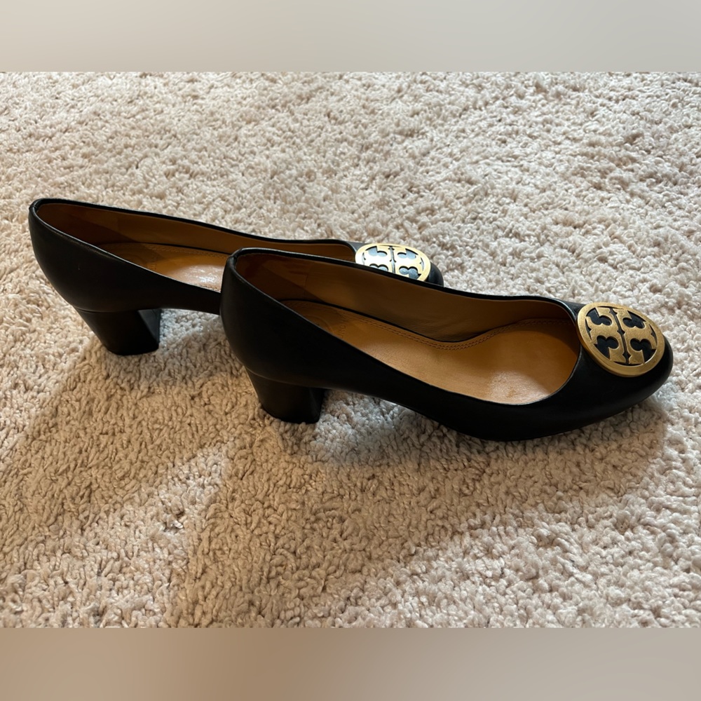 Tory Burch black leather heels with gold emblem, NWOT, never worn! Size 4.5.